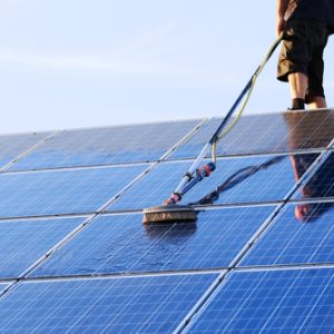Cleaning,Solar,Panels,With,Brush,And,Water